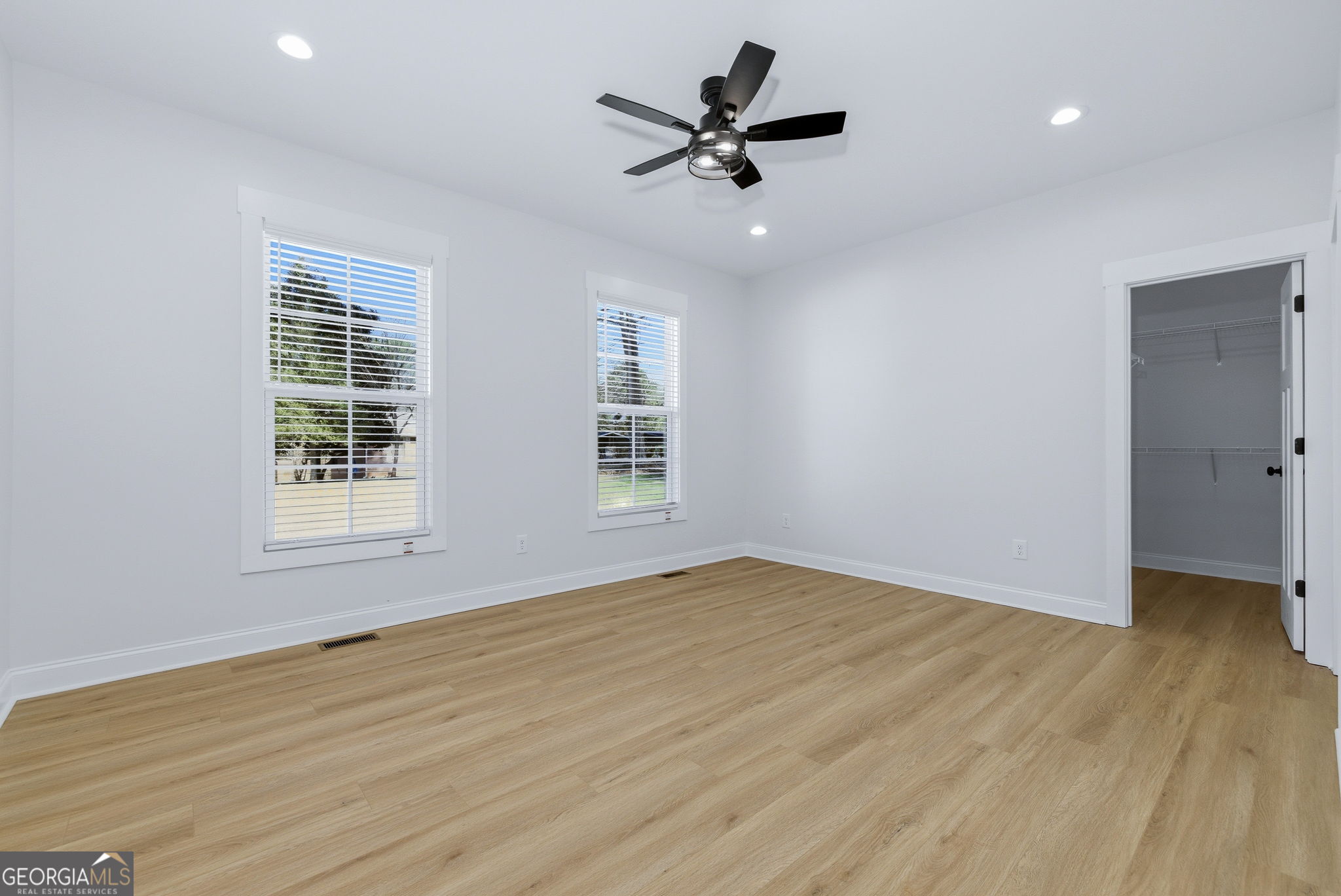 238 Carl Loudermilk Road Mount Airy, GA 30563 - Photo 13 of 28 a view of empty room with wooden floor and fan