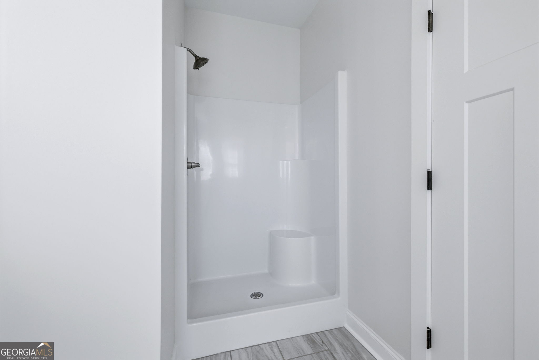 238 Carl Loudermilk Road Mount Airy, GA 30563 - Photo 16 of 28 a bathroom with a glass shower door