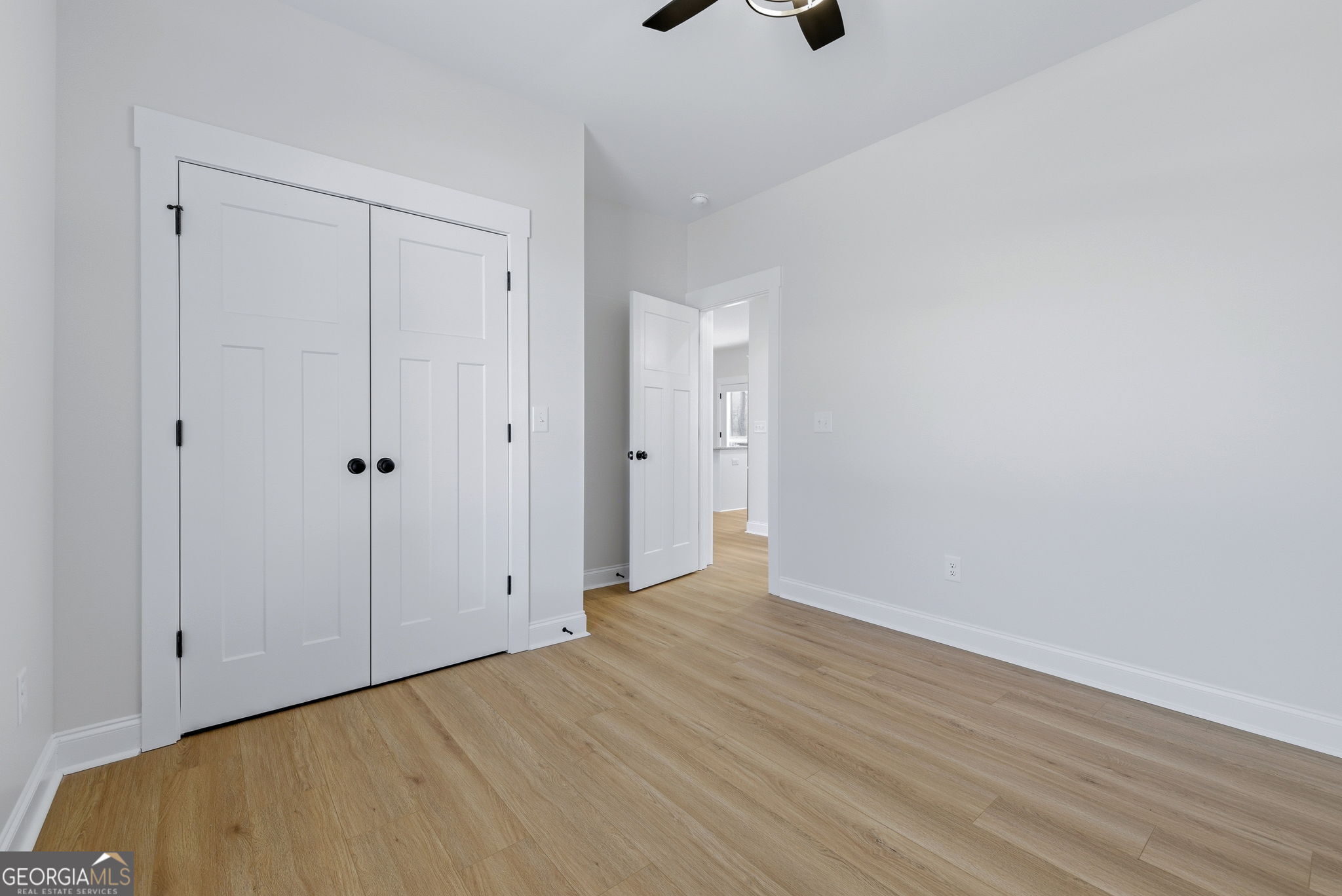 238 Carl Loudermilk Road Mount Airy, GA 30563 - Photo 19 of 28 a view of an empty room with wooden floor