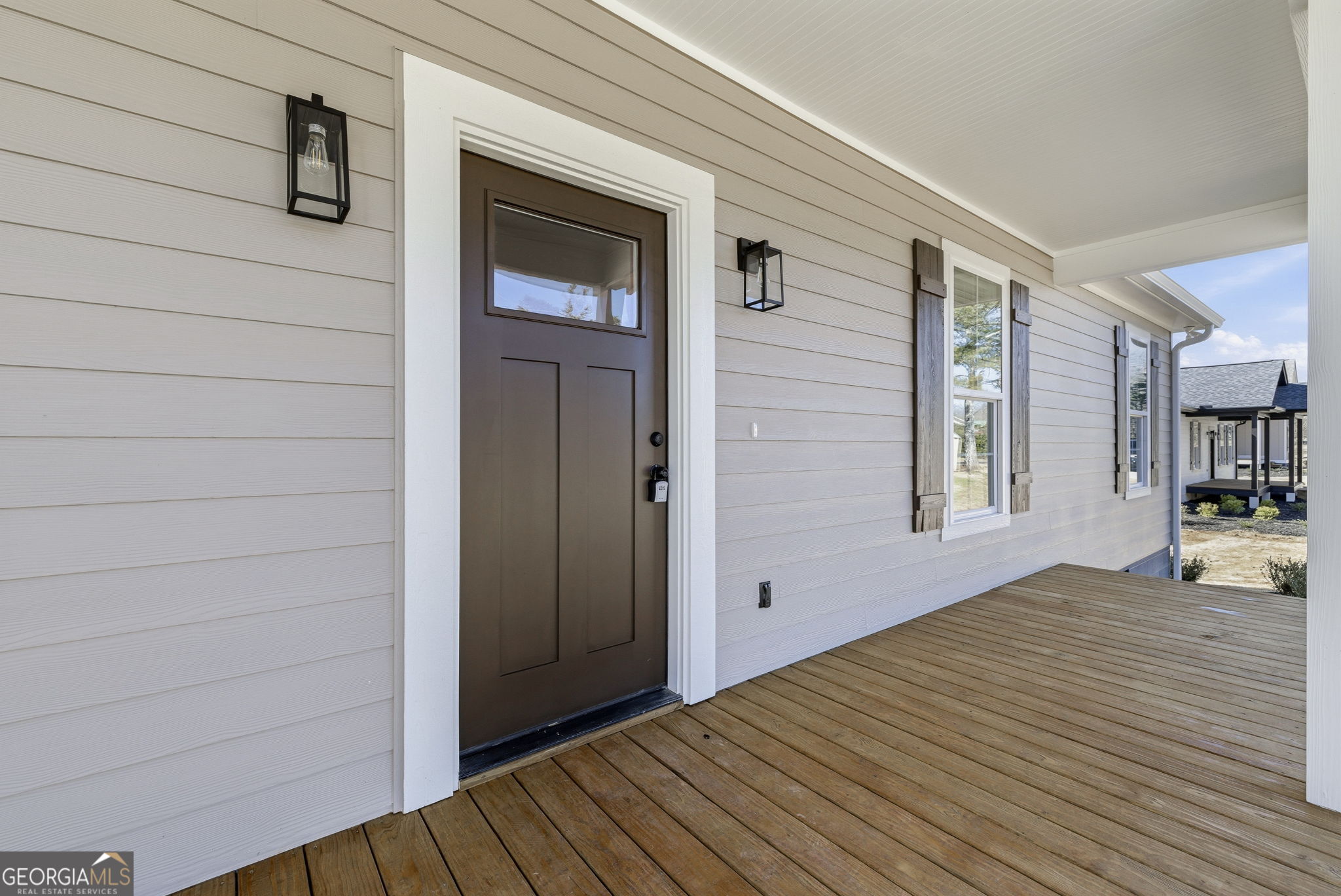 238 Carl Loudermilk Road Mount Airy, GA 30563 - Photo 2 of 28 a view of empty room with deck and window