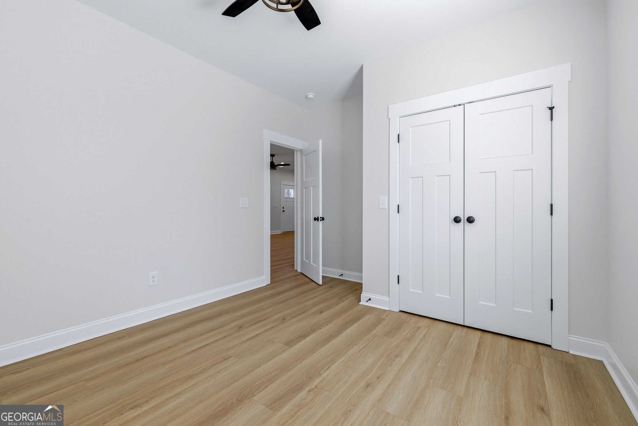 238 Carl Loudermilk Road Mount Airy, GA 30563 - Photo 21 of 28 a view of an empty room with wooden floor