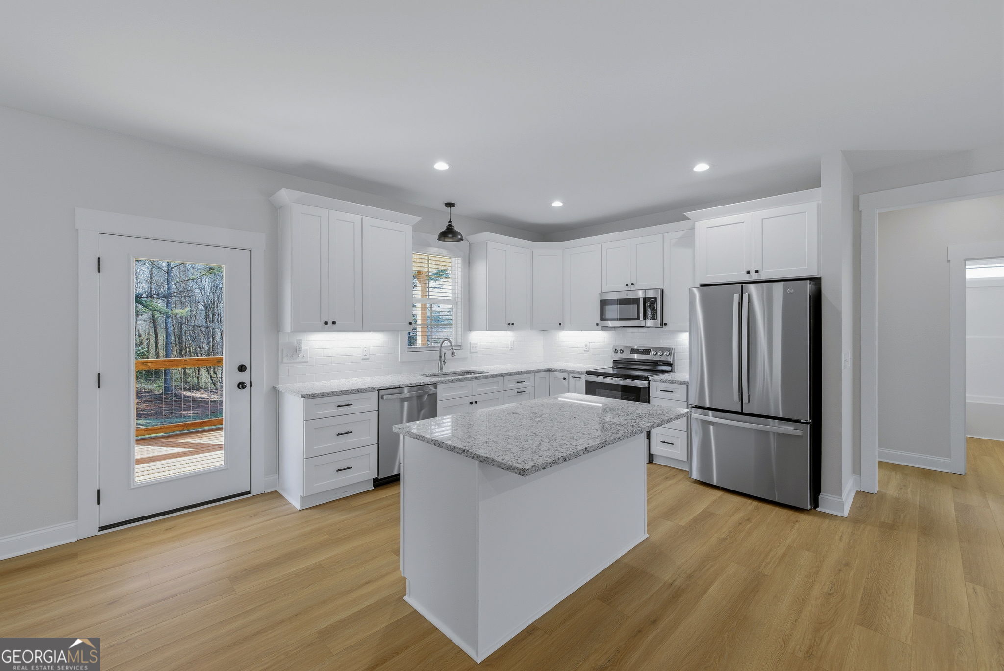 238 Carl Loudermilk Road Mount Airy, GA 30563 - Photo 6 of 28 a kitchen with stainless steel appliances granite countertop a refrigerator stove and oven