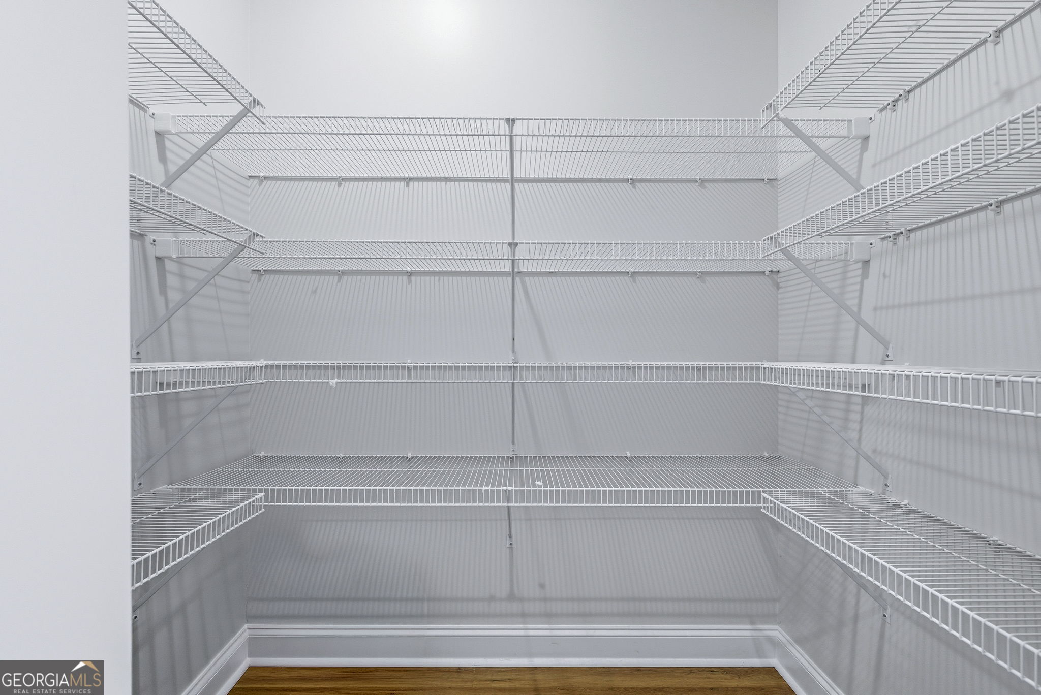 238 Carl Loudermilk Road Mount Airy, GA 30563 - Photo 10 of 28 a view of walk in closet with empty racks