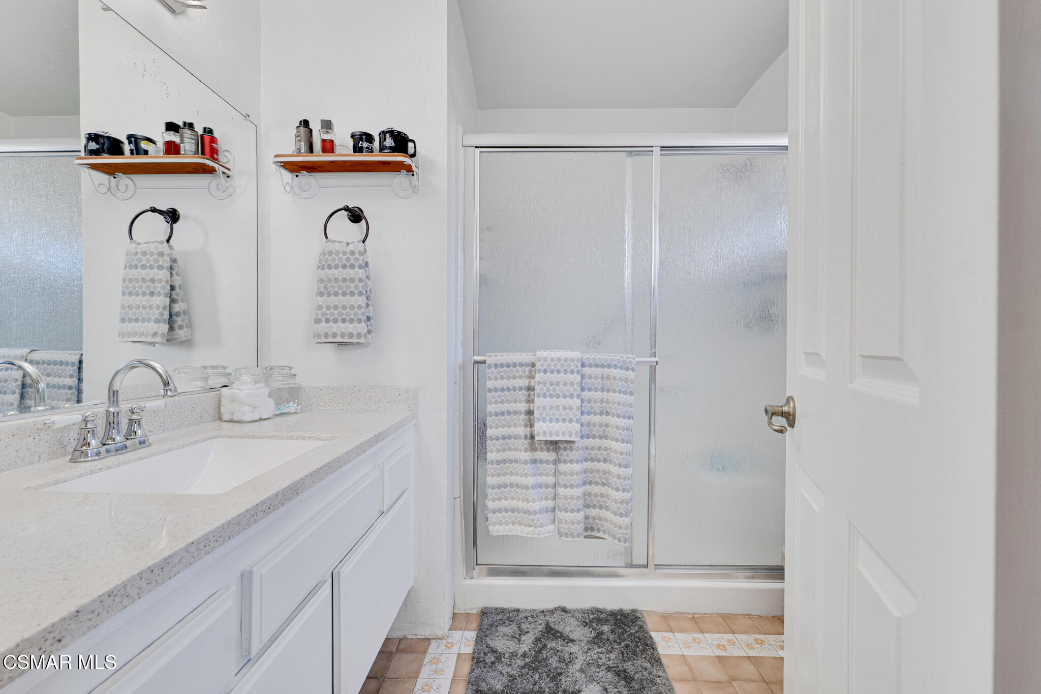 2474 Stow Street Simi Valley, CA 93063 - Photo 13 of 17 a bathroom with a sink and a mirror