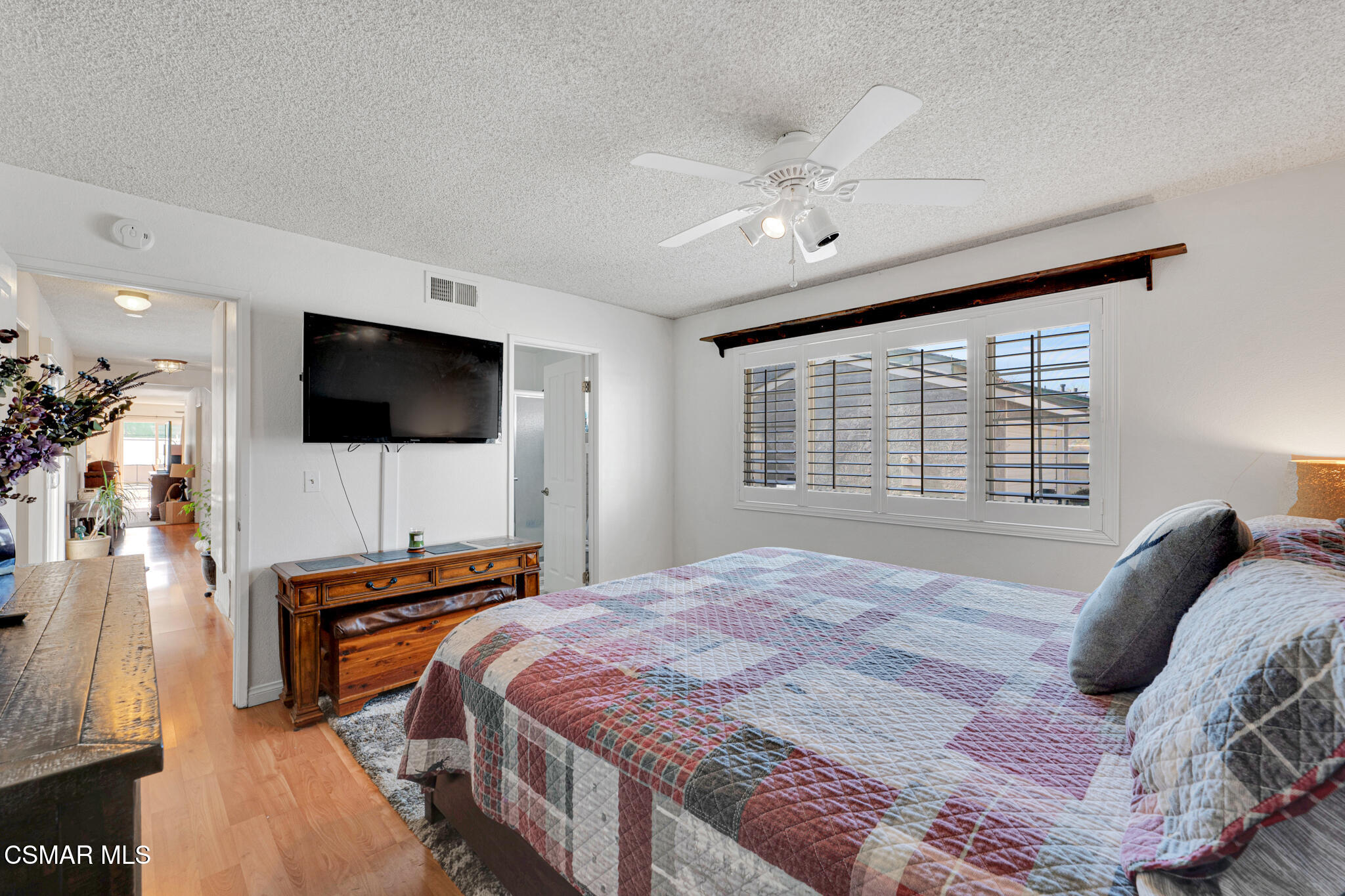 2474 Stow Street Simi Valley, CA 93063 - Photo 15 of 17 a bedroom with a bed and a flat screen tv