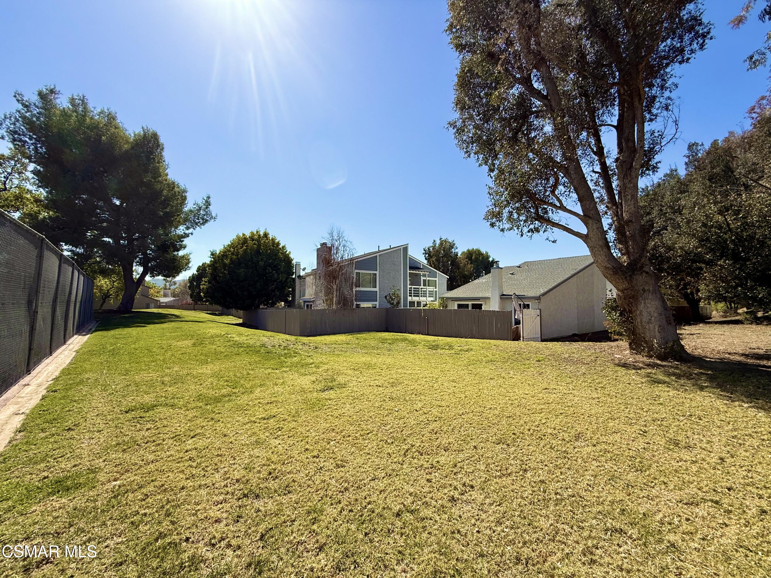 2474 Stow Street Simi Valley, CA 93063 - Photo 17 of 17 a blue swimming pool is in a backyard of house