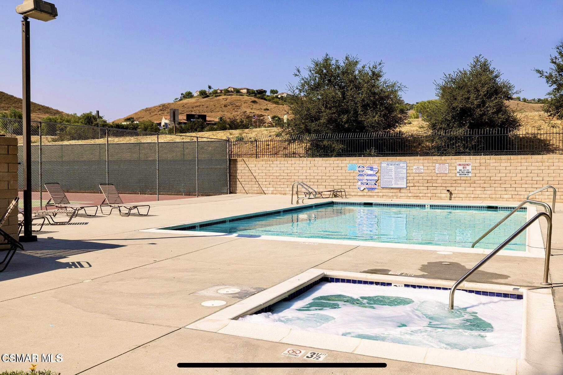 2474 Stow Street Simi Valley, CA 93063 - Photo 2 of 17 a view of a swimming pool with a yard