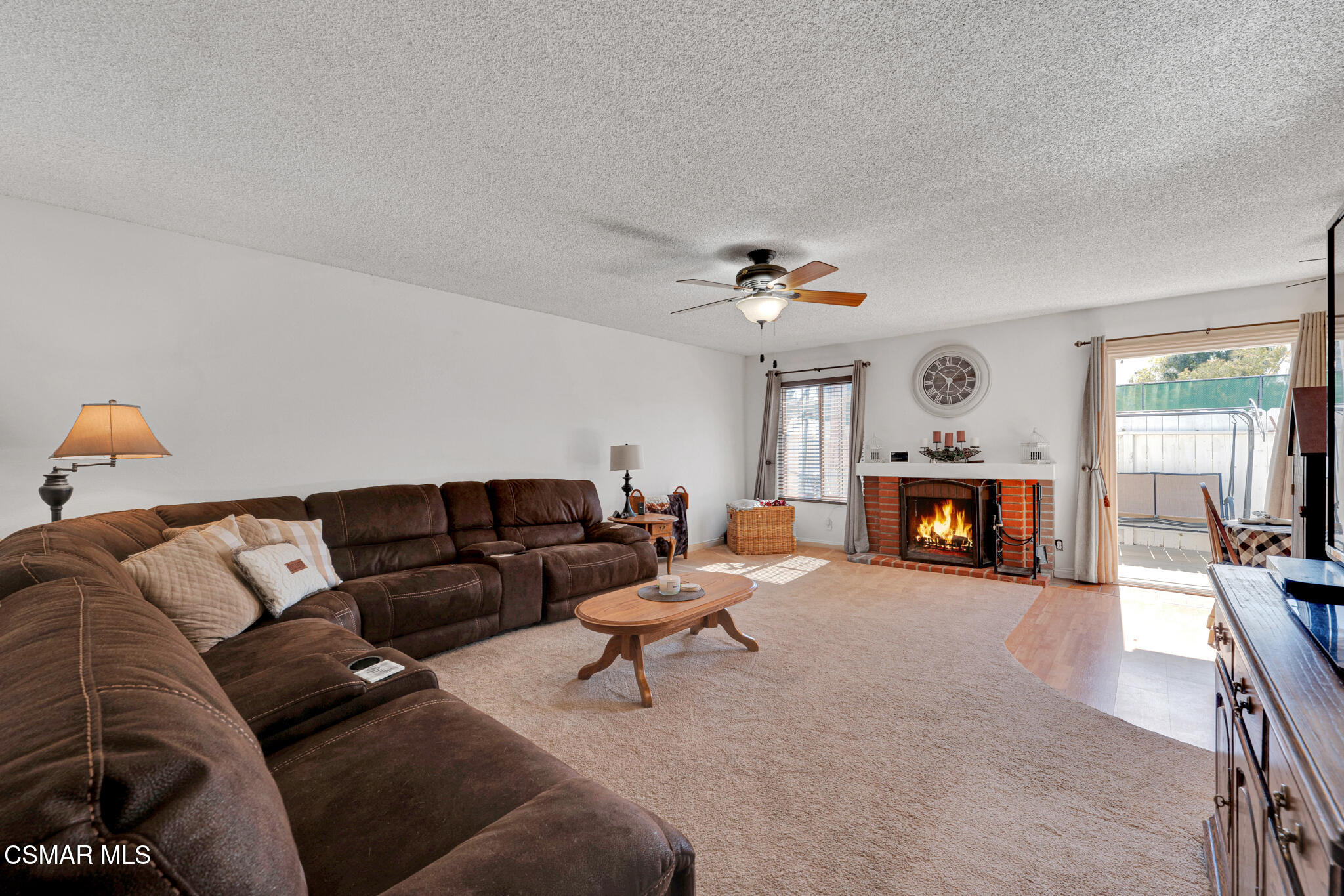 2474 Stow Street Simi Valley, CA 93063 - Photo 6 of 17 a living room with furniture and a fireplace
