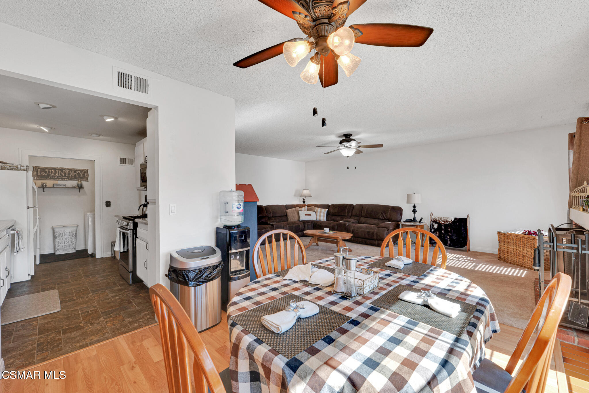 2474 Stow Street Simi Valley, CA 93063 - Photo 7 of 17 a living room with furniture and a chandelier
