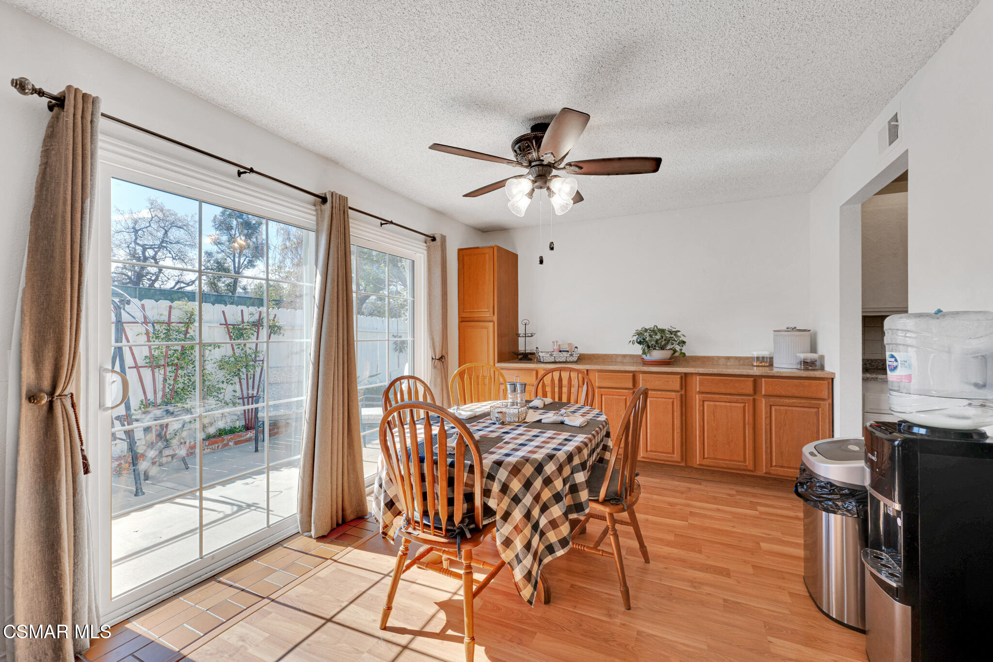 2474 Stow Street Simi Valley, CA 93063 - Photo 8 of 17 a view of a dining room with furniture window and wooden floor