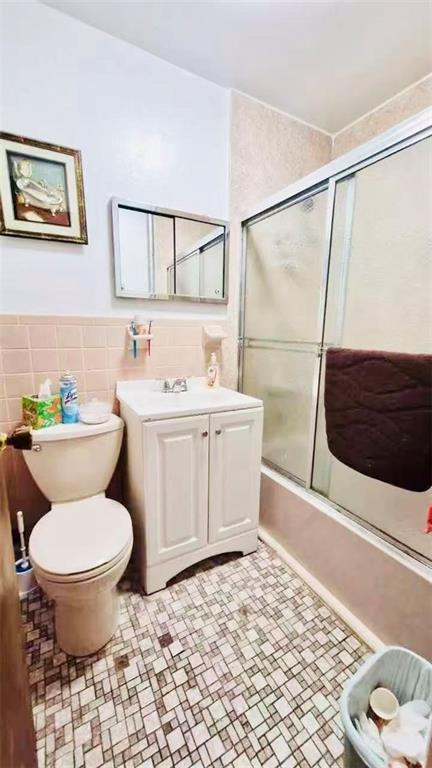 1673 83rd Street Brooklyn, NY 11214 - Photo 15 of 24 a bathroom with a sink toilet and shower