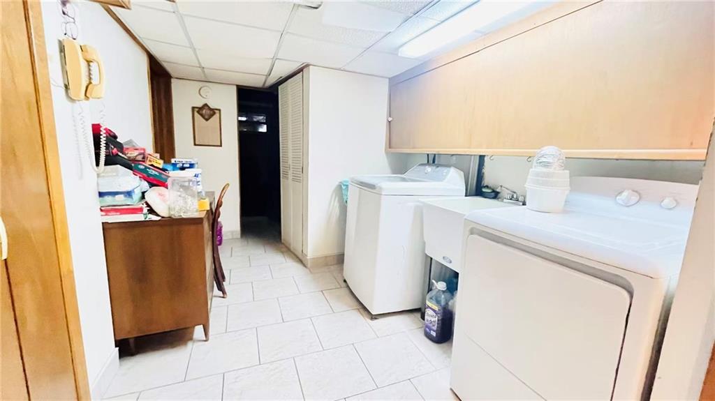 1673 83rd Street Brooklyn, NY 11214 - Photo 20 of 24 a utility room with dryer and washer