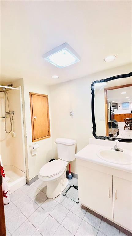 1673 83rd Street Brooklyn, NY 11214 - Photo 21 of 24 a bathroom with a sink toilet and shower