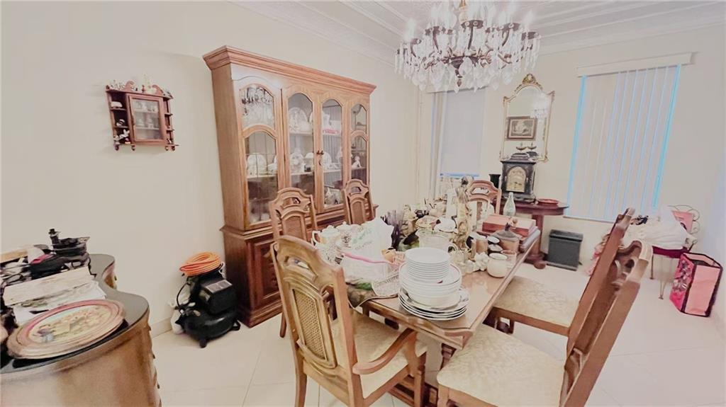 1673 83rd Street Brooklyn, NY 11214 - Photo 5 of 24 a view of a dining room with furniture wooden floor and a chandelier