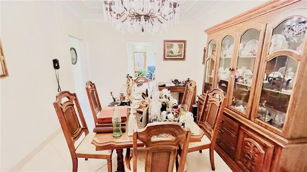 1673 83rd Street Brooklyn, NY 11214 - Photo 6 of 24 a view of a dining room with furniture and chandelier