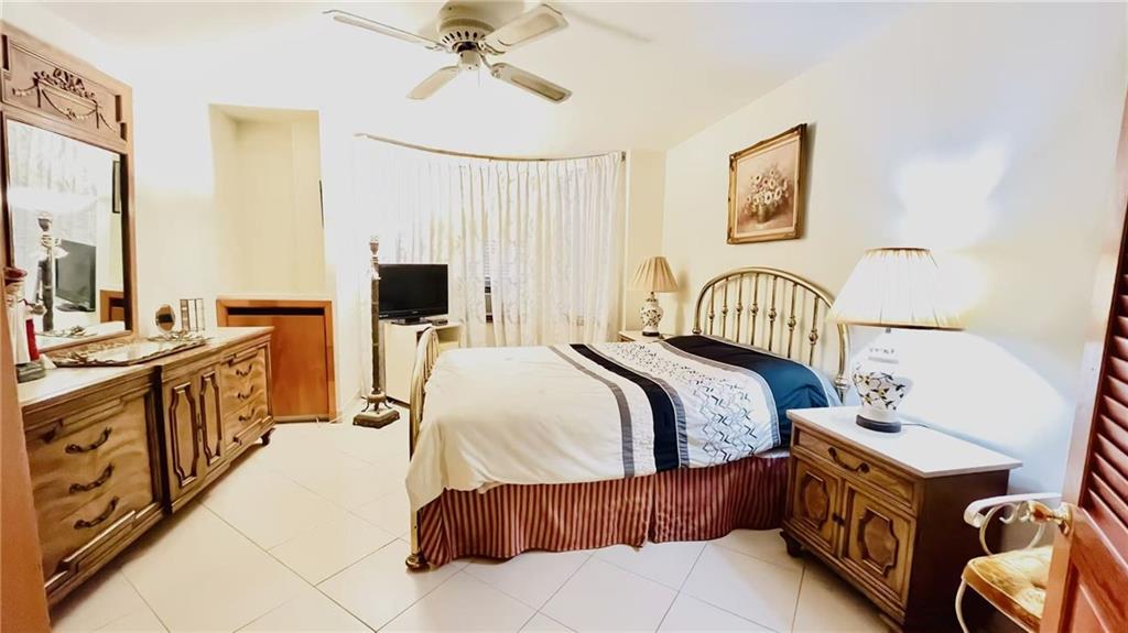 1673 83rd Street Brooklyn, NY 11214 - Photo 7 of 24 a bedroom with a bed and wooden floor