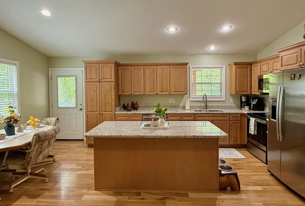 72 Victory Lane Murphy, NC 28906 - Photo 17 of 64 a view of a kitchen with kitchen island a counter top space a sink stainless steel appliances and cabinets