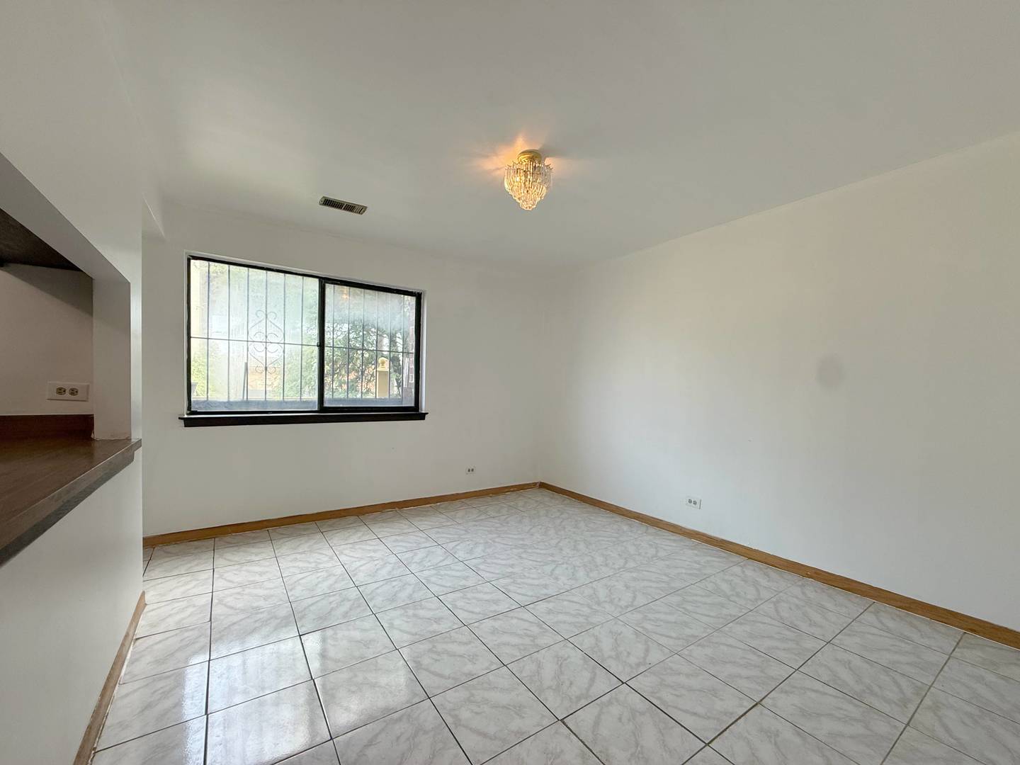 349 West 26th Street Chicago, IL 60616 - Photo 6 of 31 a view of an empty room with a window
