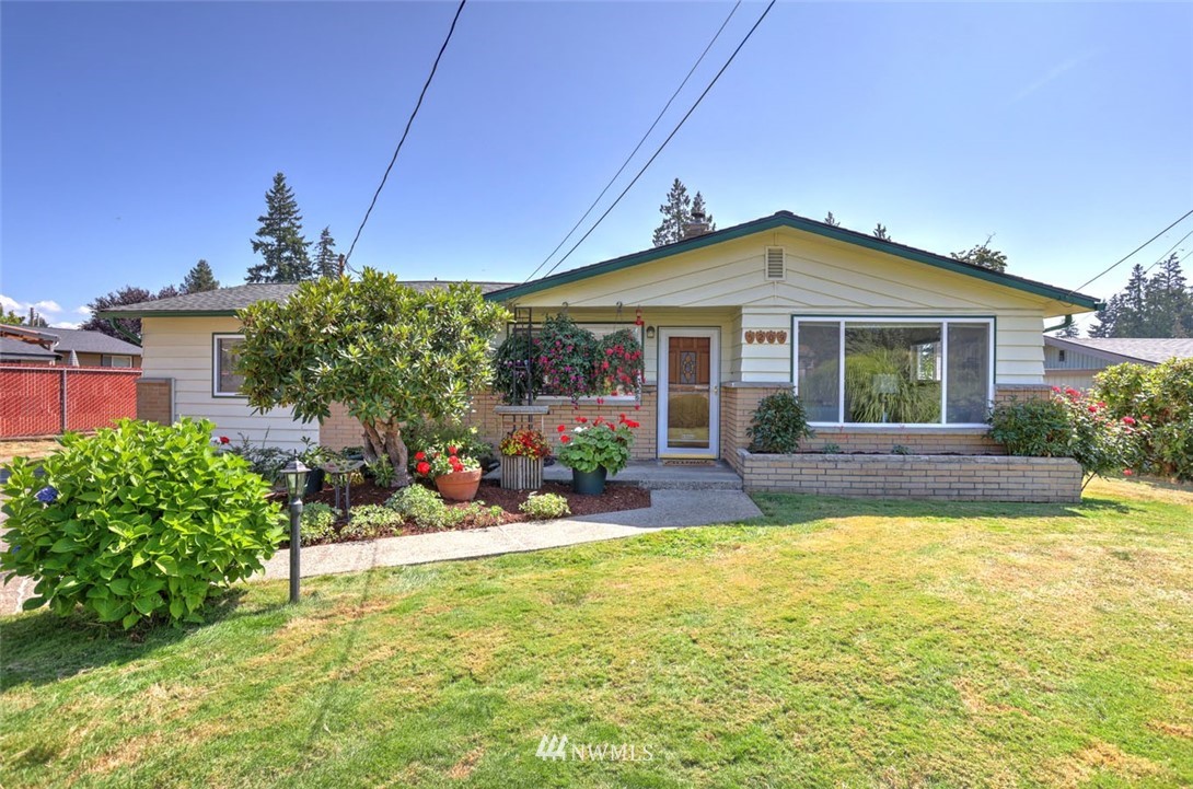 5209 Northeast 3rd Street Renton, WA 98059 - Photo 1 of 31 a view of a house with swimming pool