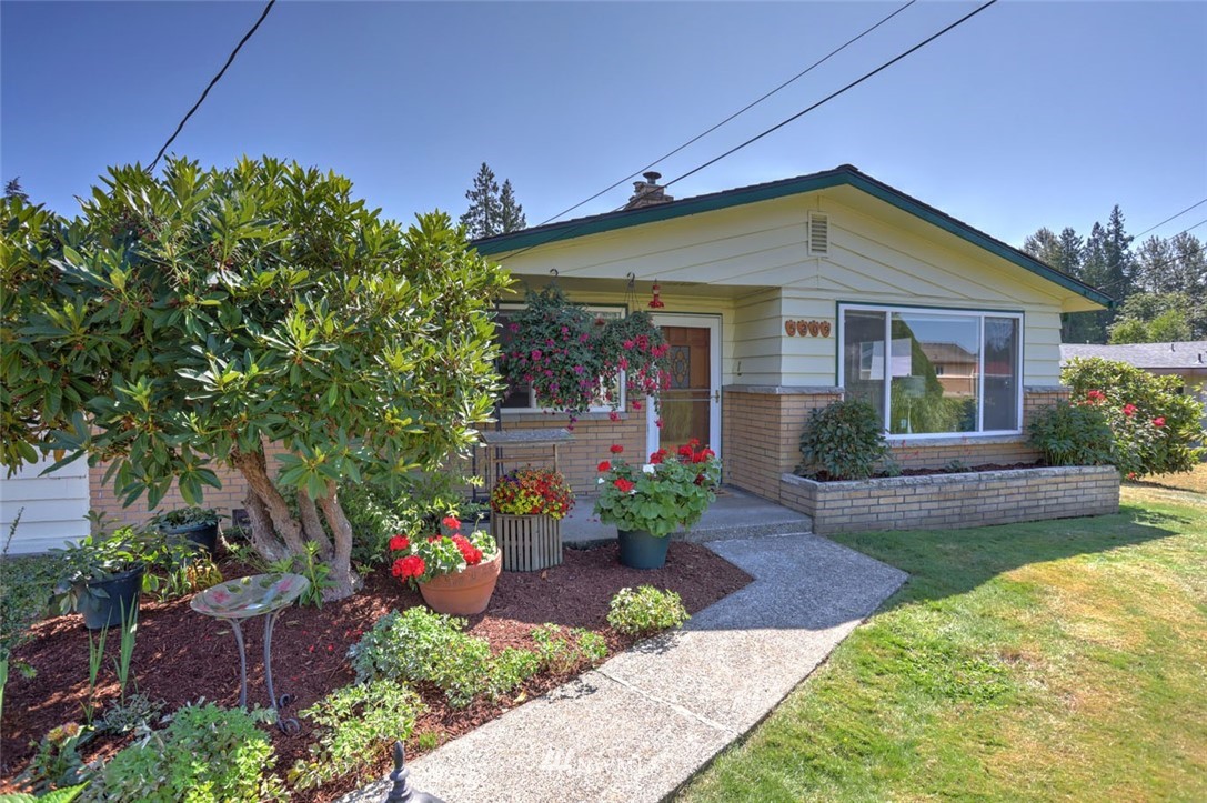 5209 Northeast 3rd Street Renton, WA 98059 - Photo 2 of 31 a front view of a house with a yard