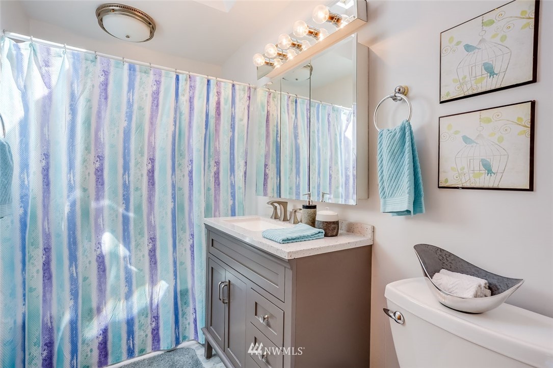 5209 Northeast 3rd Street Renton, WA 98059 - Photo 17 of 31 a bathroom with a sink and a mirror