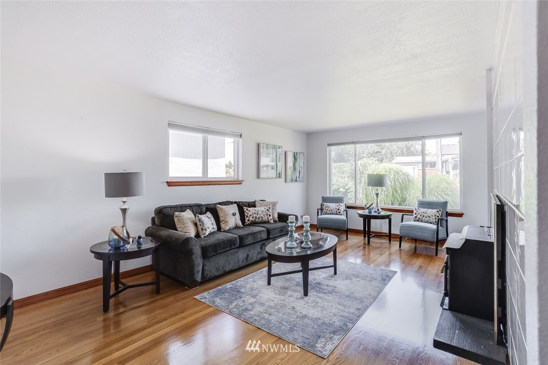 5209 Northeast 3rd Street Renton, WA 98059 - Photo 3 of 31 a living room with furniture and a large window