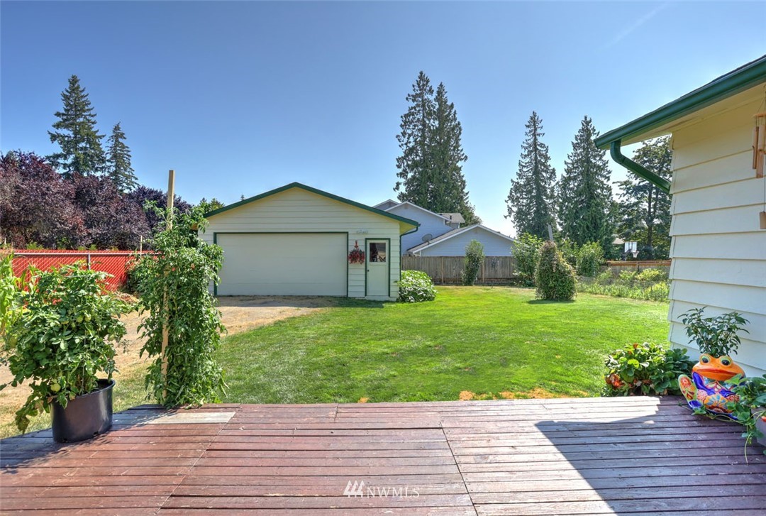 5209 Northeast 3rd Street Renton, WA 98059 - Photo 23 of 31 a front view of a house with a yard and potted plants