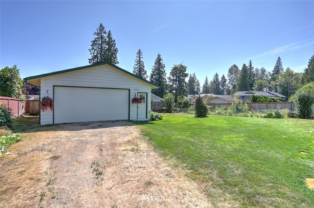 5209 Northeast 3rd Street Renton, WA 98059 - Photo 24 of 31 a front view of a house with garden