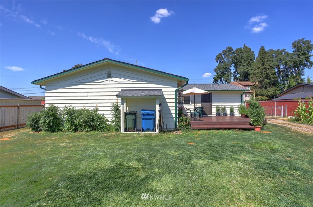 5209 Northeast 3rd Street Renton, WA 98059 - Photo 26 of 31 a front view of a house with a yard