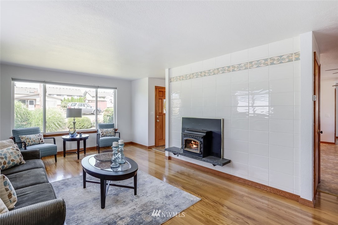 5209 Northeast 3rd Street Renton, WA 98059 - Photo 4 of 31 a living room with furniture and a fireplace