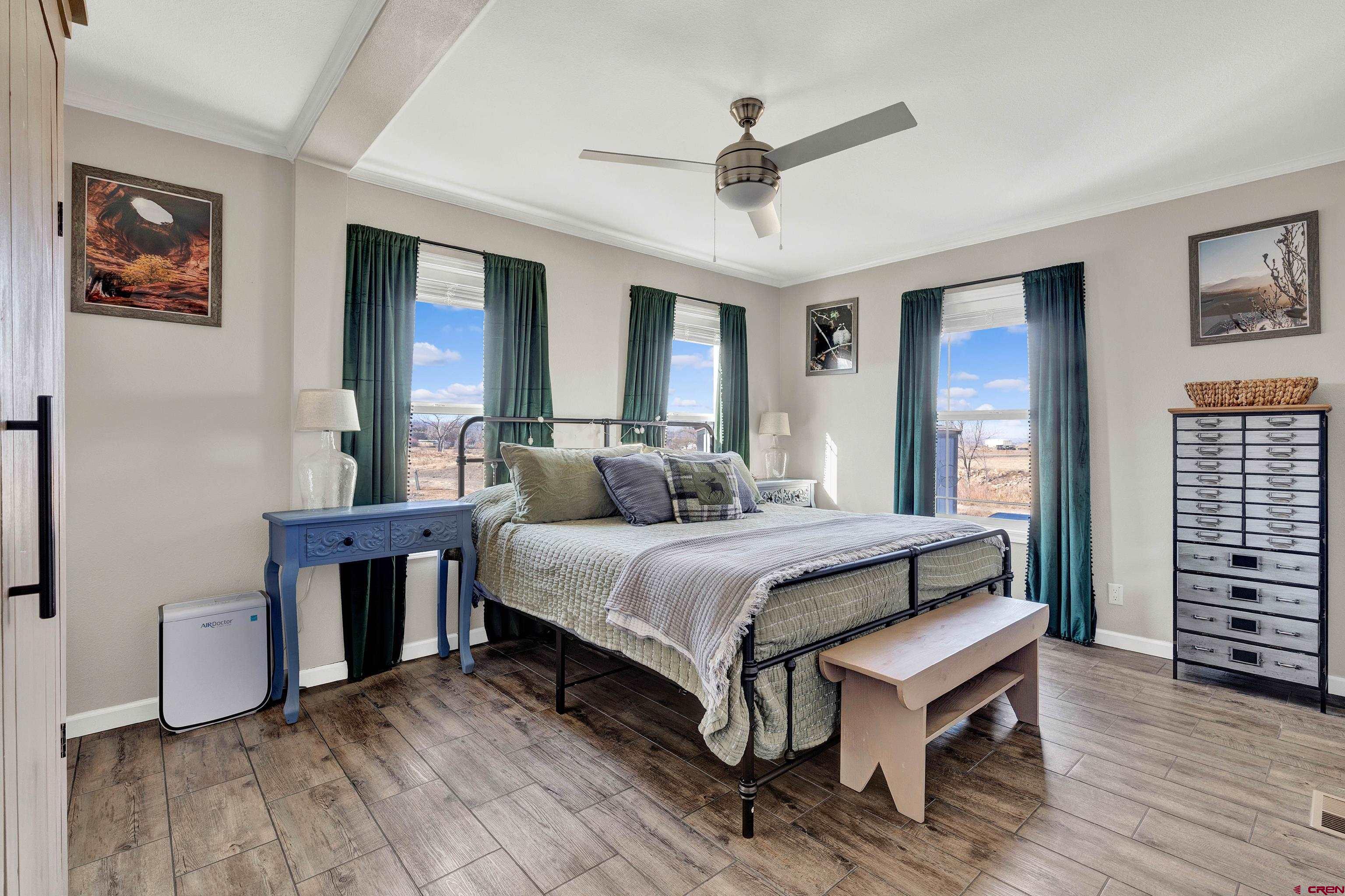 901 6530 Road, Unit 2813 Montrose, CO 81401 - Photo 15 of 34 a bed room with a bed and a window