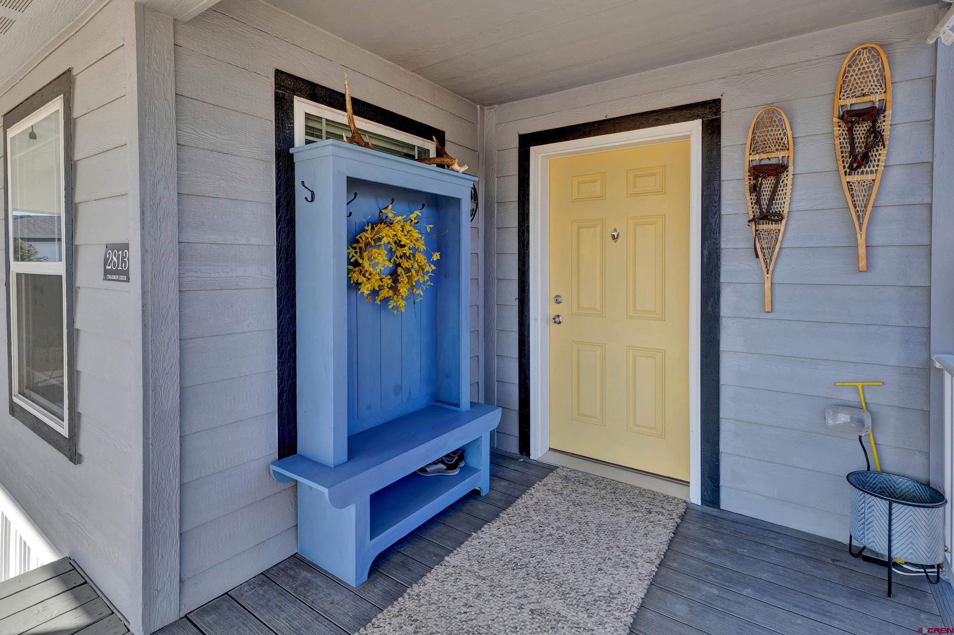 901 6530 Road, Unit 2813 Montrose, CO 81401 - Photo 3 of 34 a view of front door with wooden floor