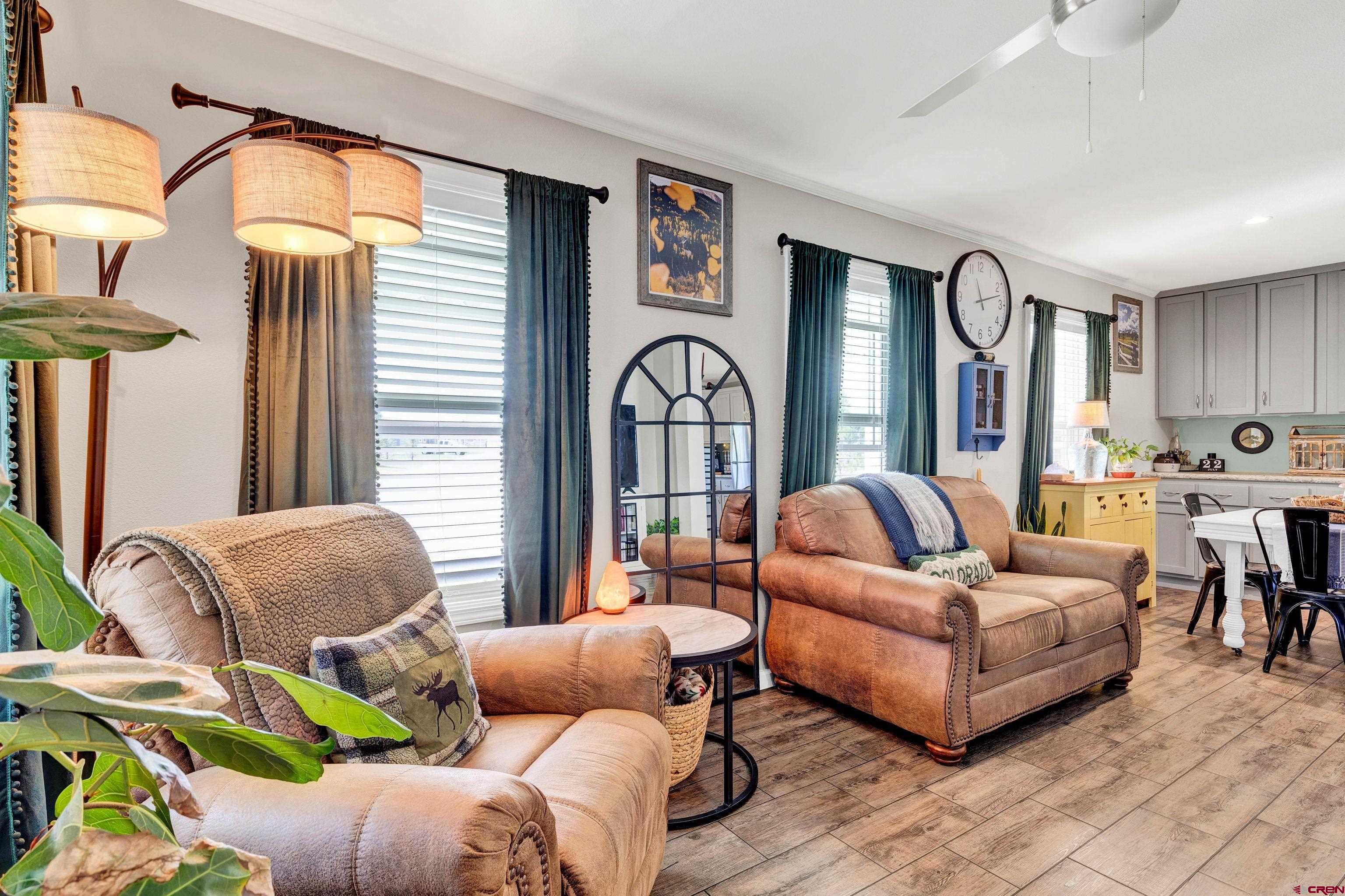 901 6530 Road, Unit 2813 Montrose, CO 81401 - Photo 4 of 34 a living room with furniture and a large window