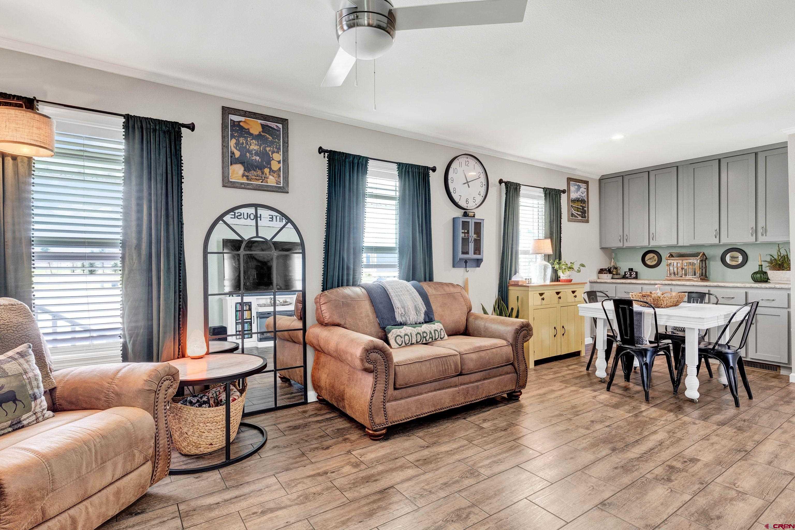 901 6530 Road, Unit 2813 Montrose, CO 81401 - Photo 5 of 34 a living room with furniture and a large window