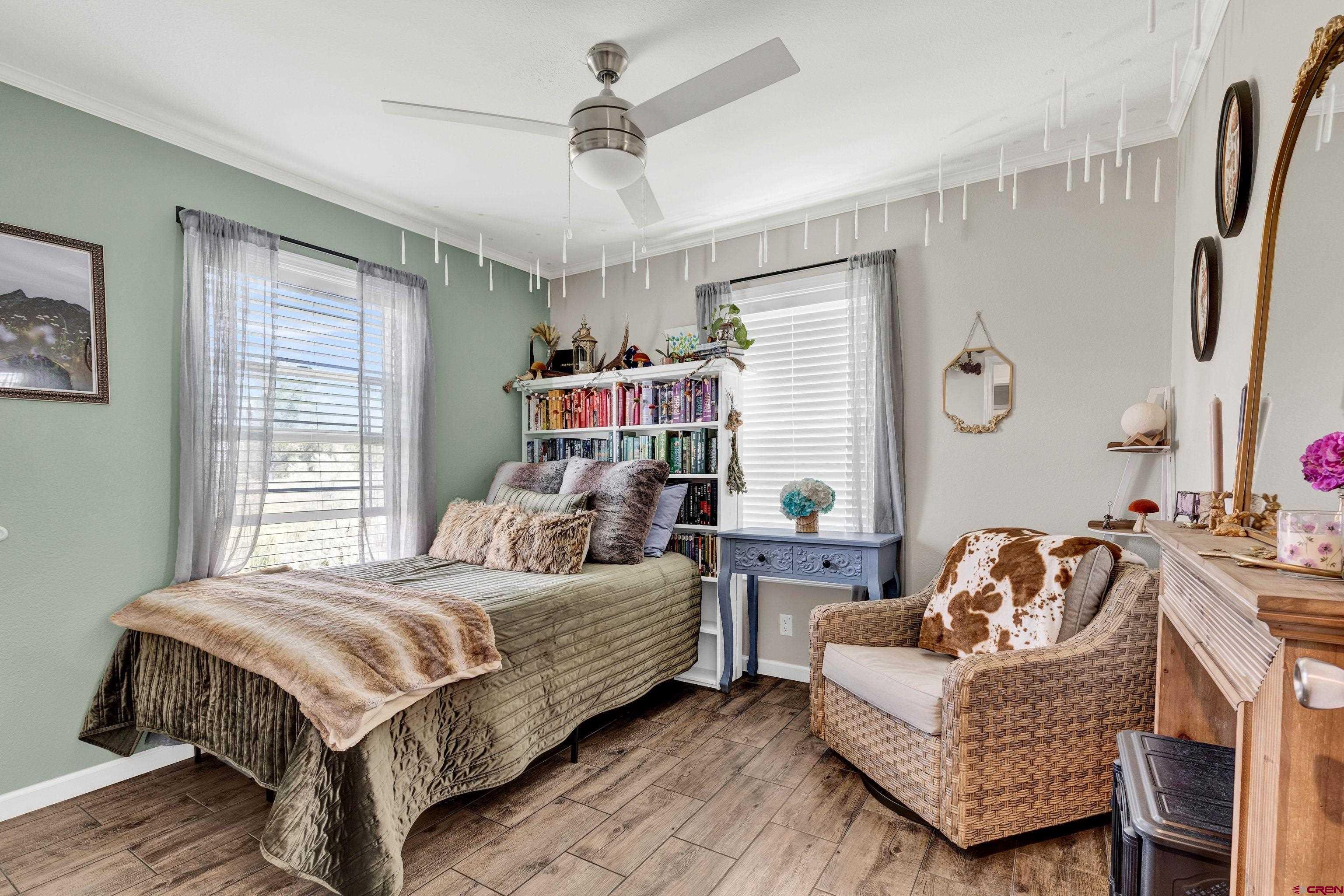901 6530 Road, Unit 2813 Montrose, CO 81401 - Photo 9 of 34 a bedroom with a bed couch and a window