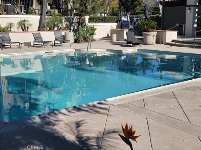 a view of a swimming pool with a patio