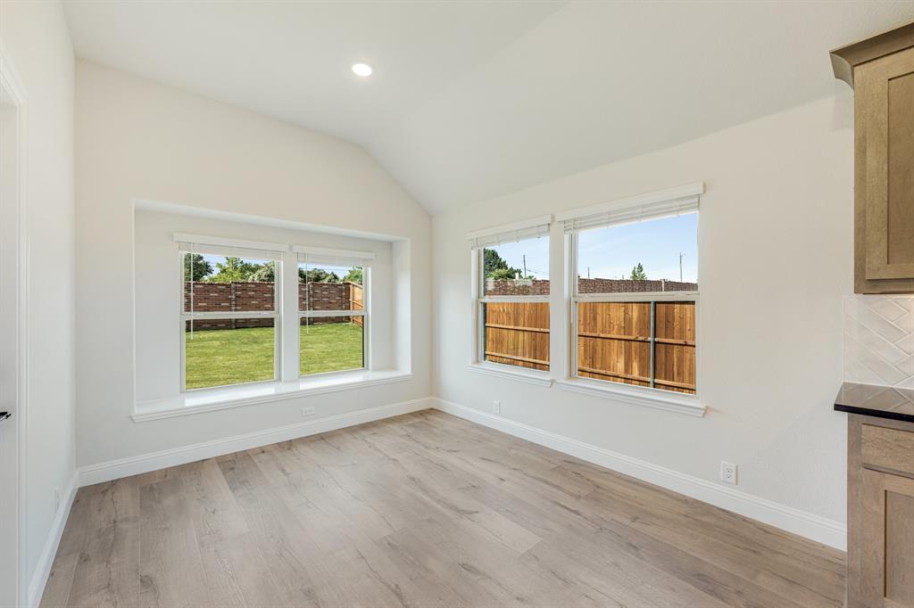 729 Seahawk Street Joshua, TX 76058 - Photo 17 of 40 an empty room with wooden floor and windows