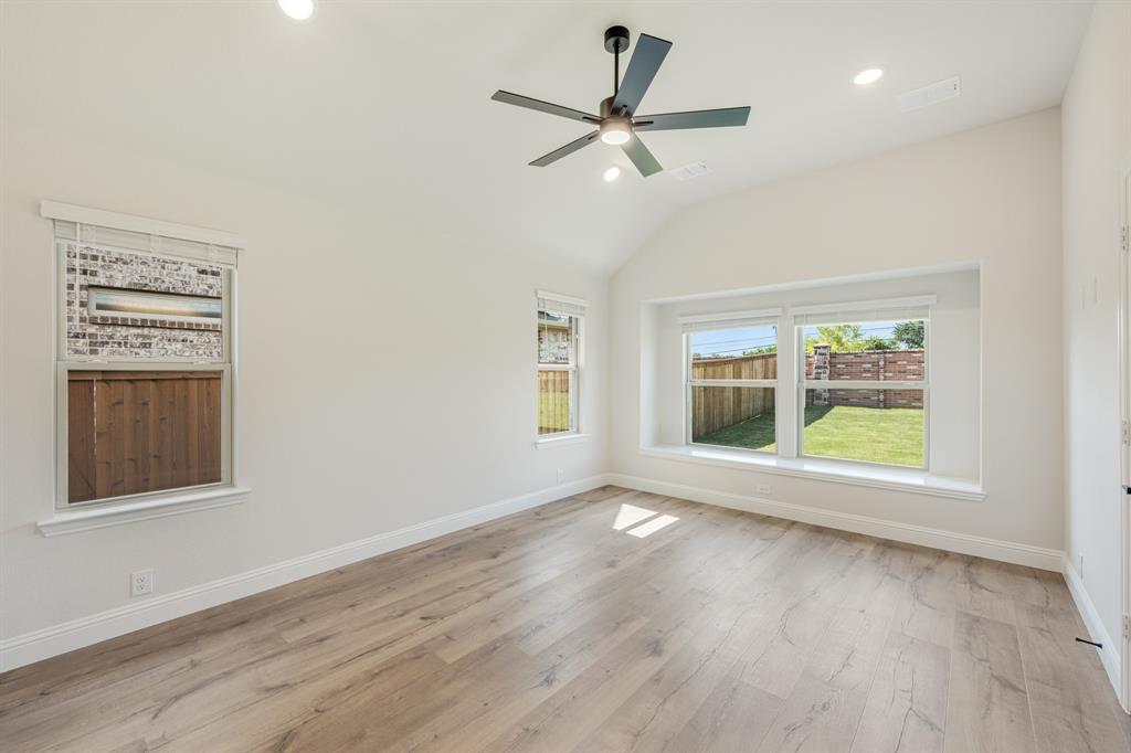 729 Seahawk Street Joshua, TX 76058 - Photo 20 of 40 a view of an empty room with a window and wooden floor
