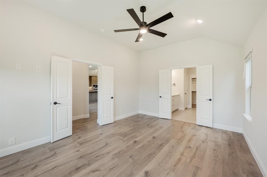 729 Seahawk Street Joshua, TX 76058 - Photo 21 of 40 an empty room and wooden door