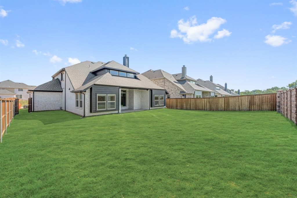 729 Seahawk Street Joshua, TX 76058 - Photo 38 of 40 a view of a house with a yard