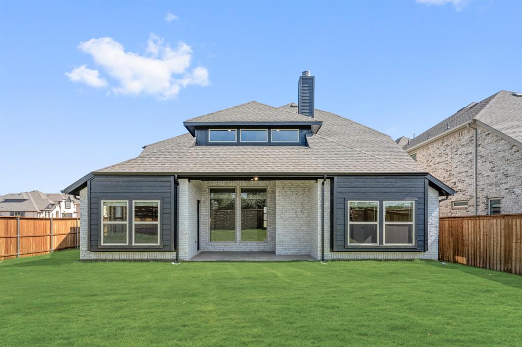 729 Seahawk Street Joshua, TX 76058 - Photo 39 of 40 a front view of a house with a garden
