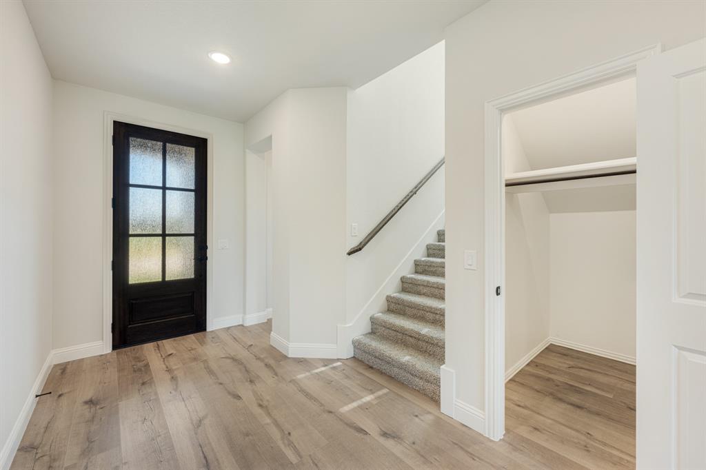 729 Seahawk Street Joshua, TX 76058 - Photo 5 of 40 a view of empty room with wooden floor and fan