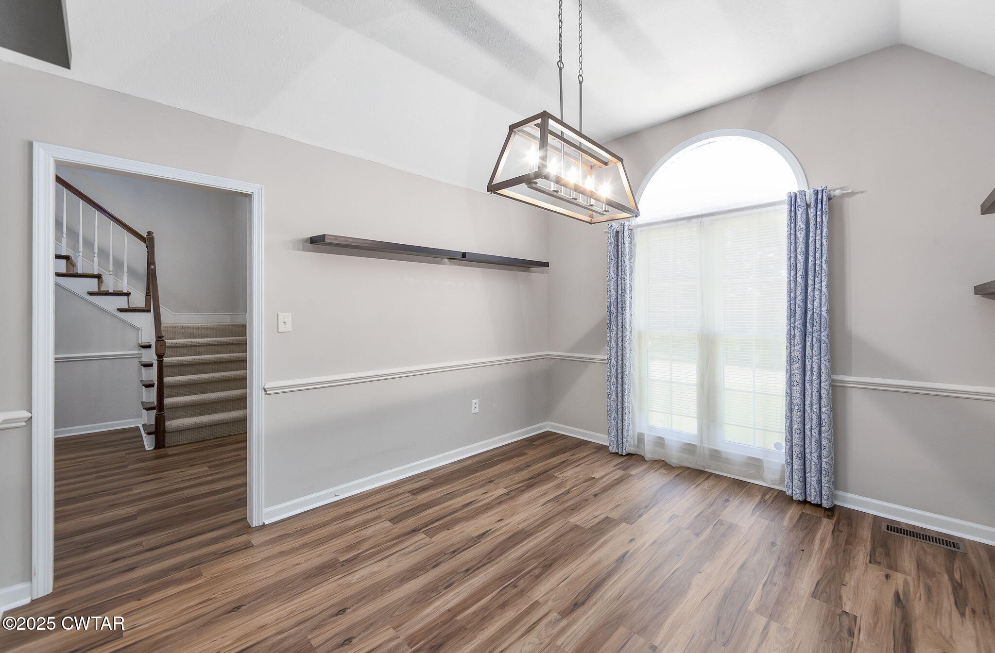 463 MCO Road Jackson, TN 38305 - Photo 17 of 36 an empty room with wooden floor fan and windows