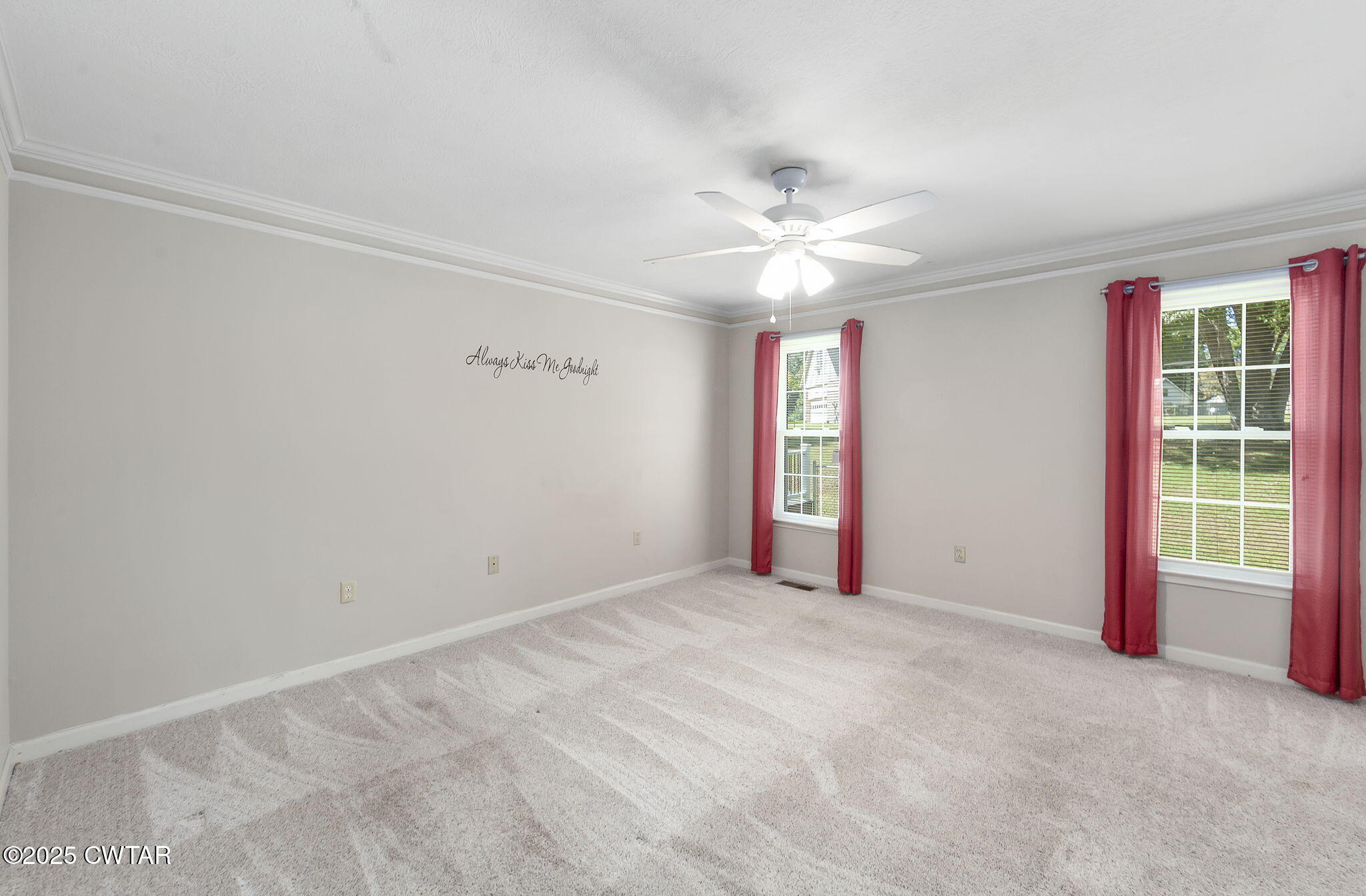 463 MCO Road Jackson, TN 38305 - Photo 19 of 36 an empty room with windows and fan