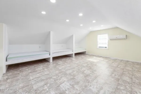 an empty room with white walls and window