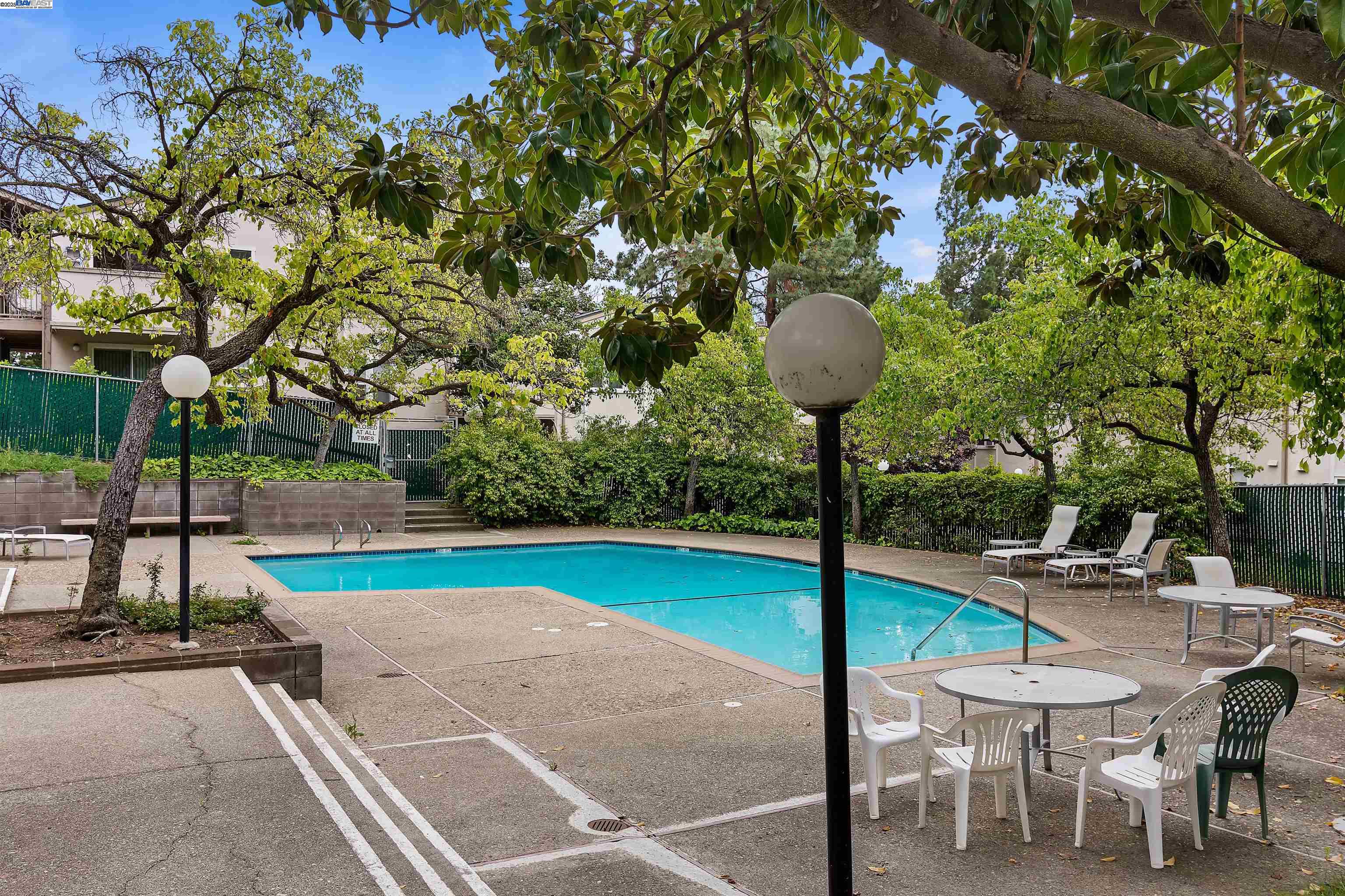 385 Camelback Road, Unit 2 Pleasant Hill, CA 94523 - Photo 17 of 19 a view of a table and chairs in the patio with a small yard