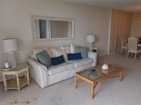 a living room with furniture and a table