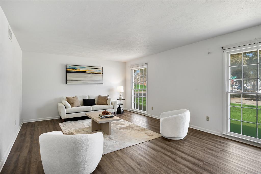 a living room with furniture and window