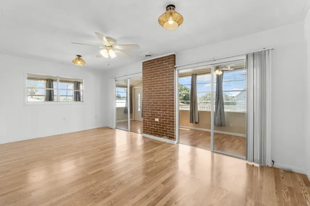 a kitchen with stainless steel appliances granite countertop a refrigerator and a stove