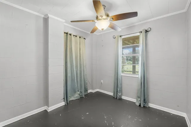 a kitchen with a refrigerator and a stove
